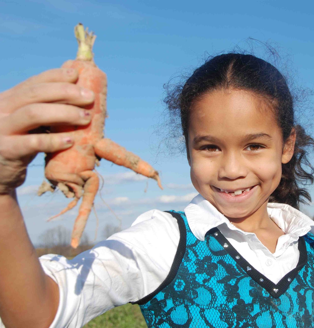 Kid picking carrots